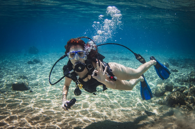 Mergulho em Cozumel: sinal de OK significa que está tudo bem com o mergulhador